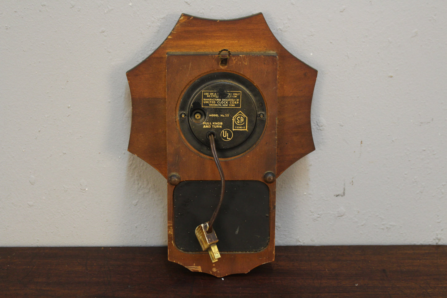United 1950s Pendulum Wall Clock