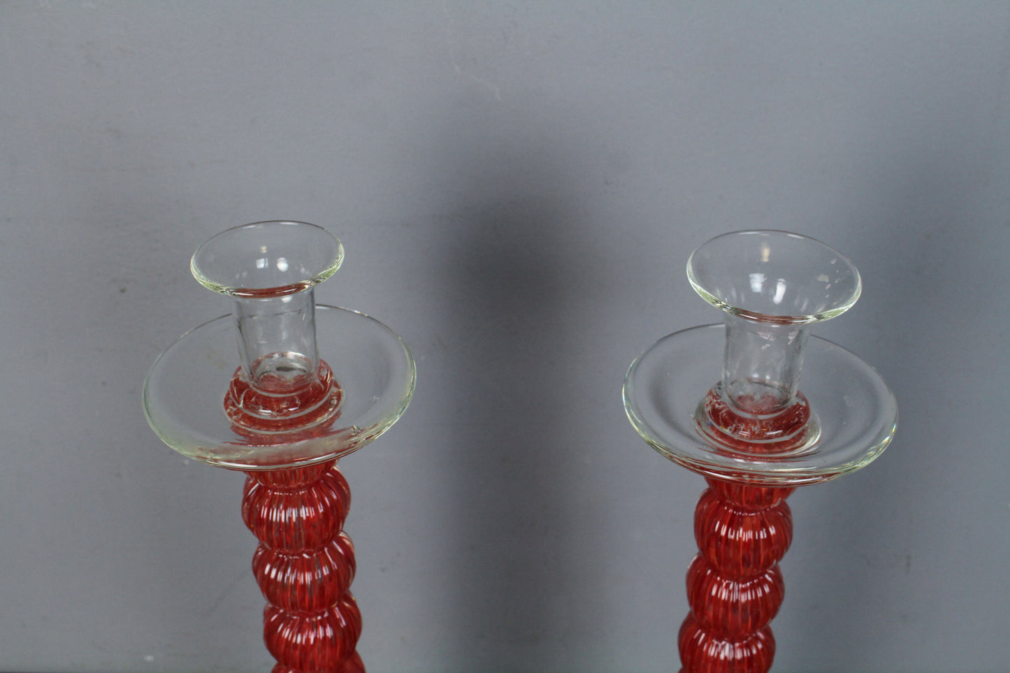 Pair Of Tall Red Glass Candlesticks