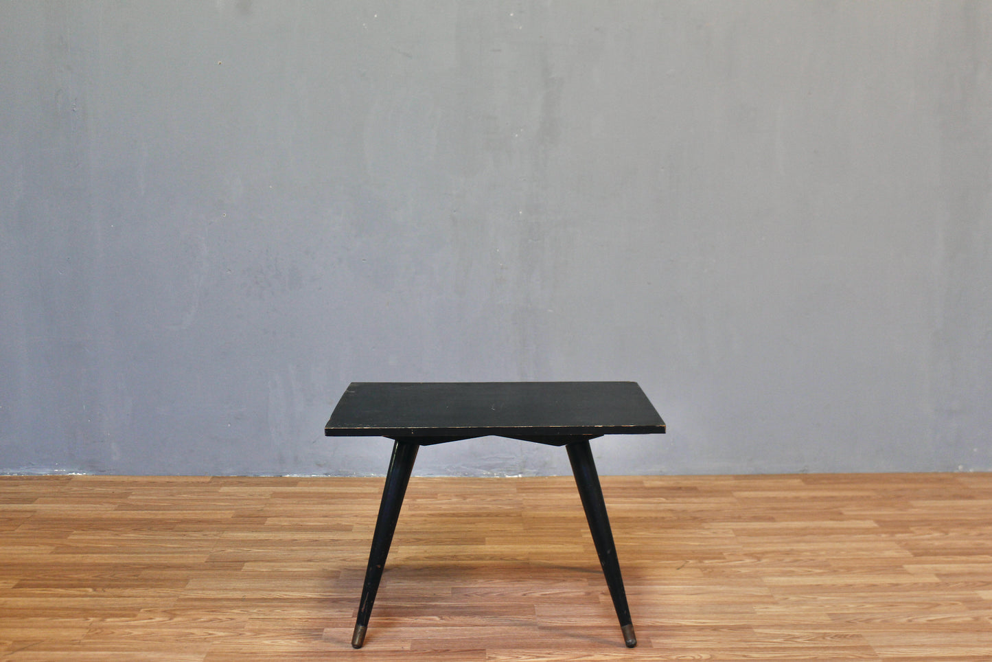 Compact Atomic Black Swivel-Top Coffee Table
