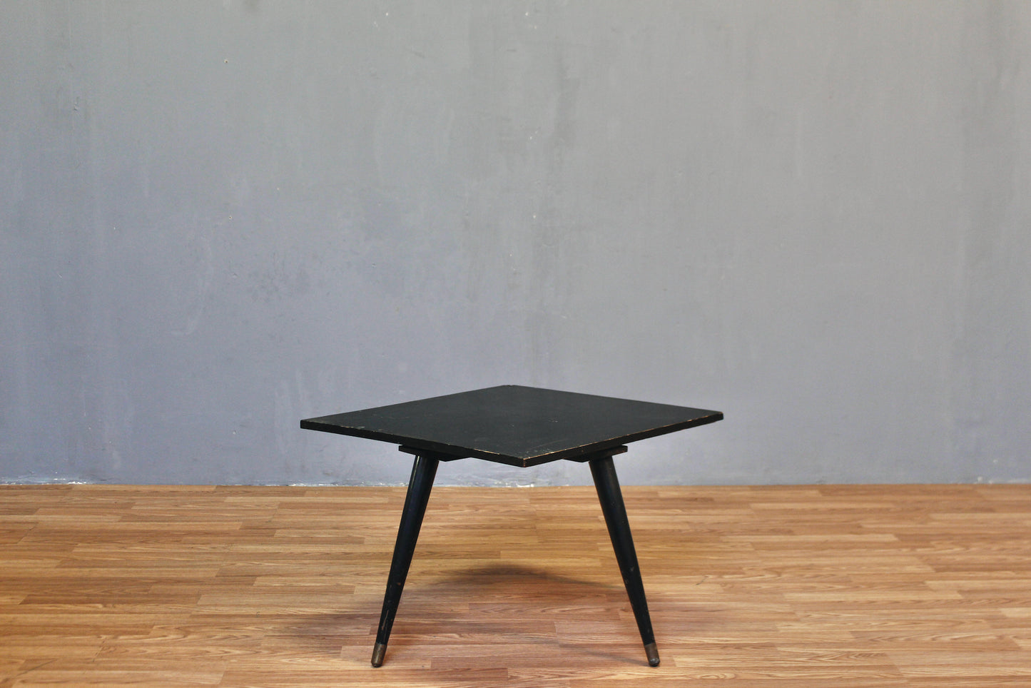 Compact Atomic Black Swivel-Top Coffee Table