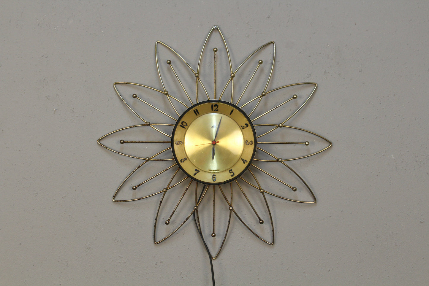 Atomic Gold Burst Wall Clock