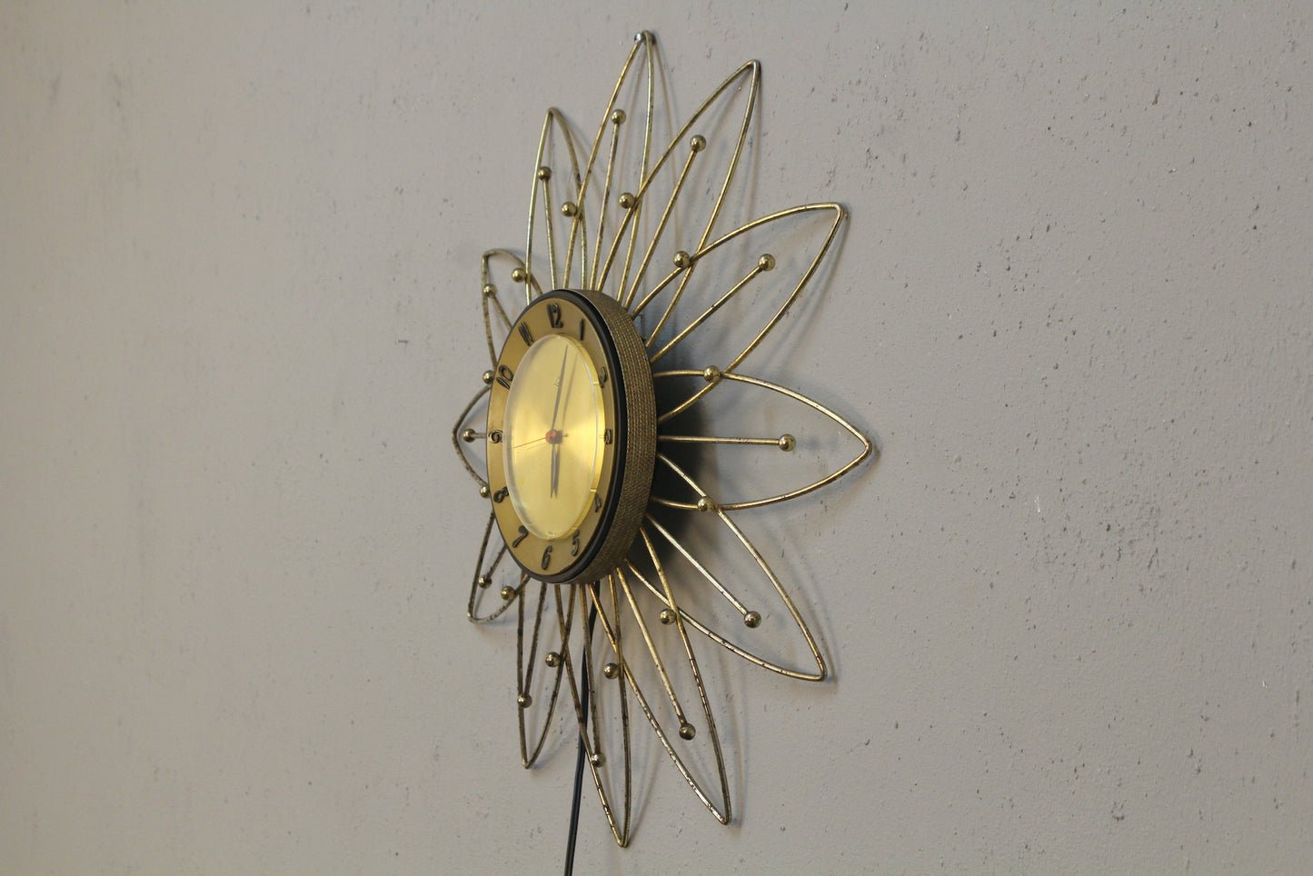 Atomic Gold Burst Wall Clock