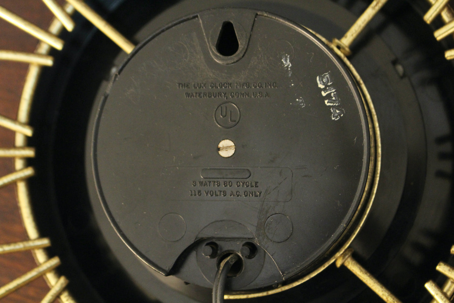 Atomic Gold Burst Wall Clock