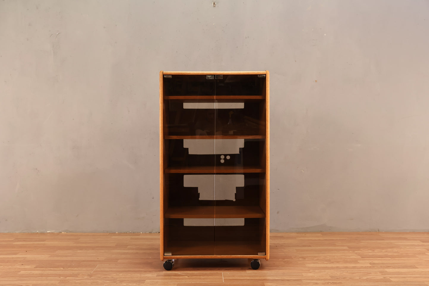 Blonde Oak & Smoked Glass Rolling Media Cabinet