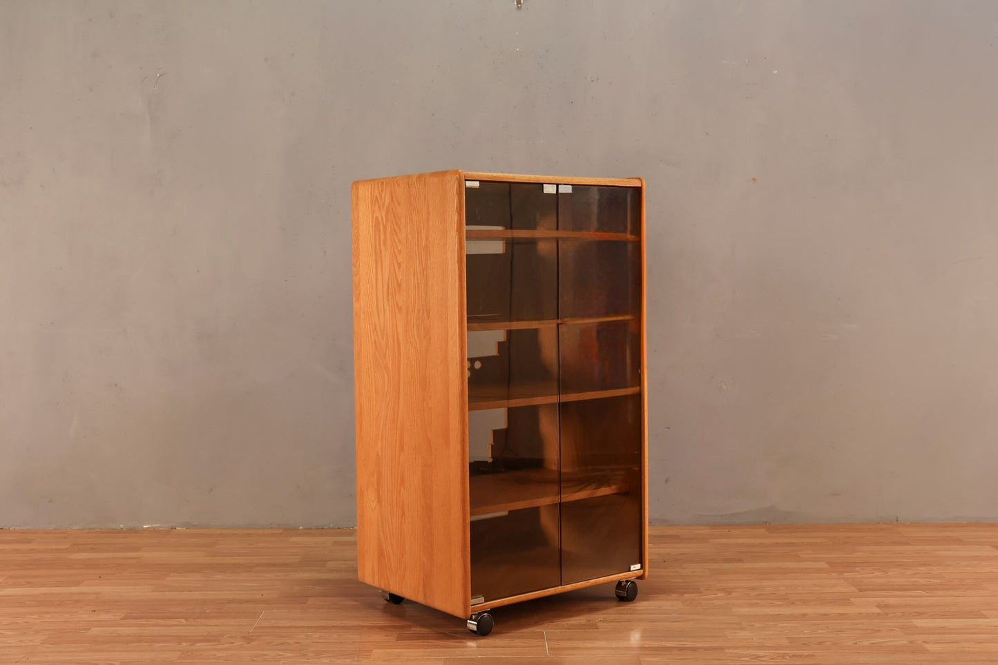 Blonde Oak & Smoked Glass Rolling Media Cabinet