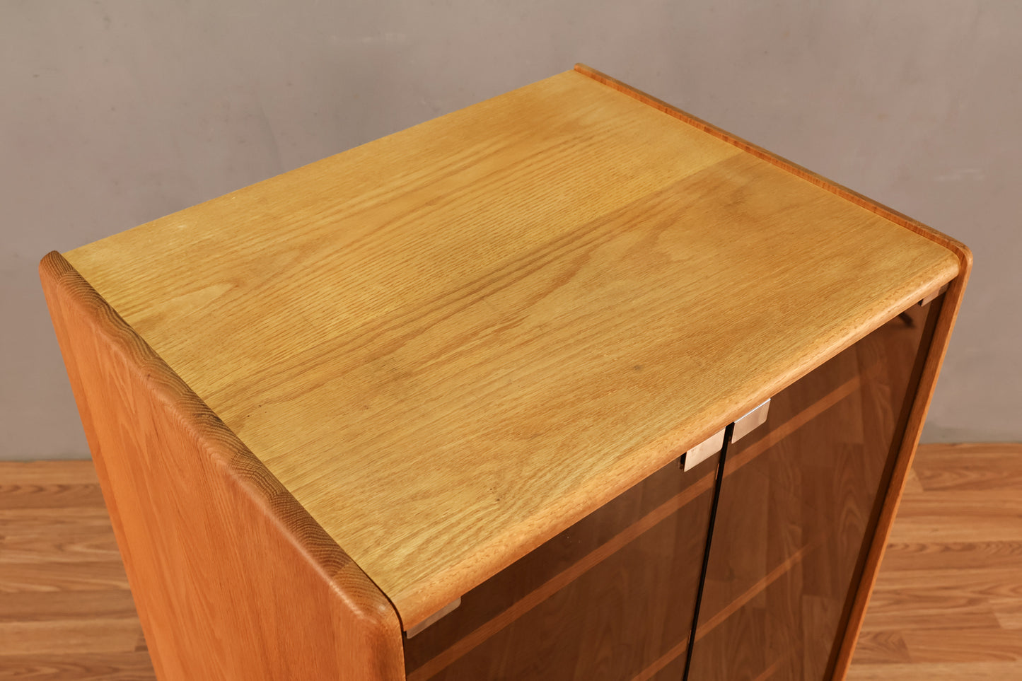 Blonde Oak & Smoked Glass Rolling Media Cabinet