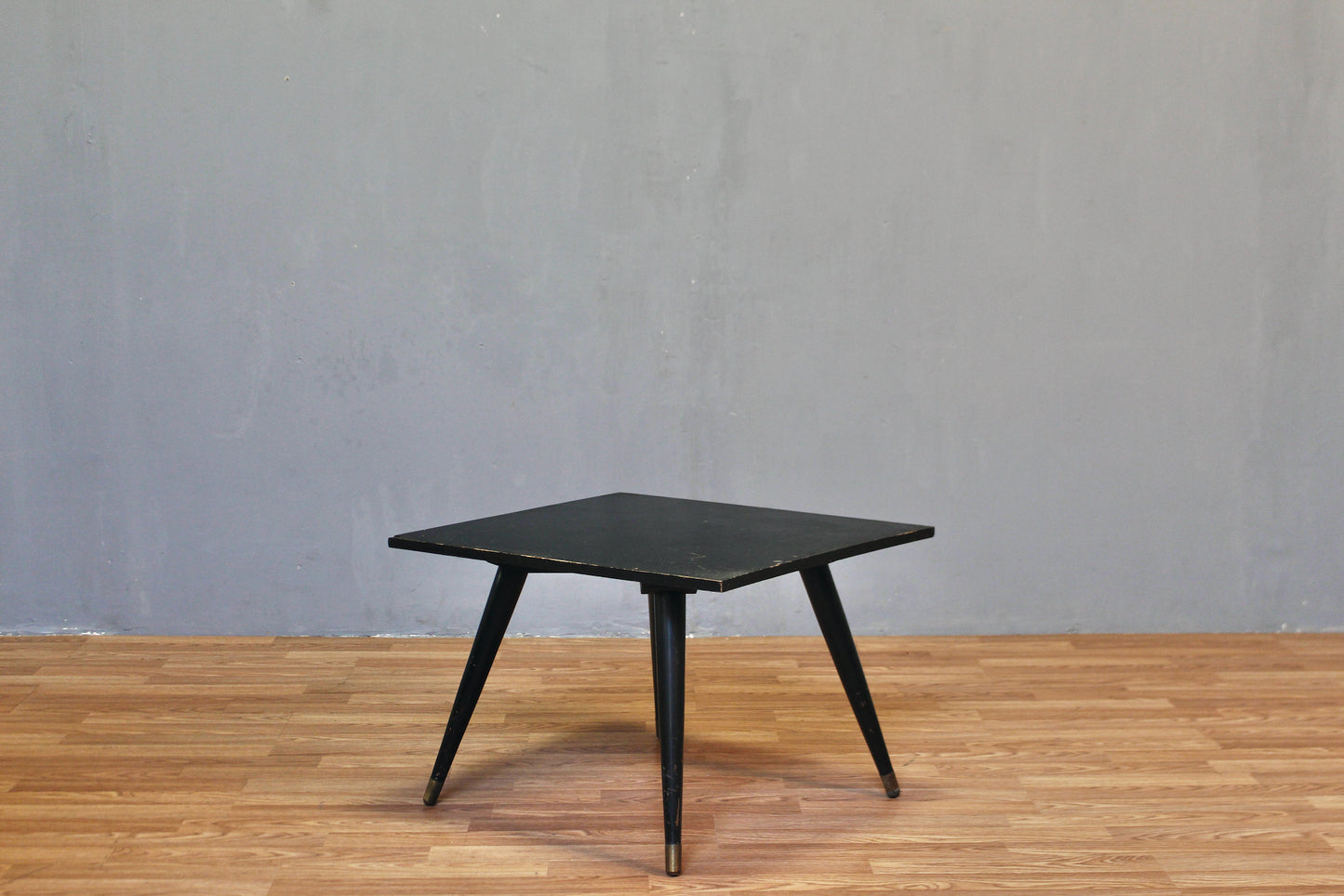 Compact Atomic Black Swivel-Top Coffee Table