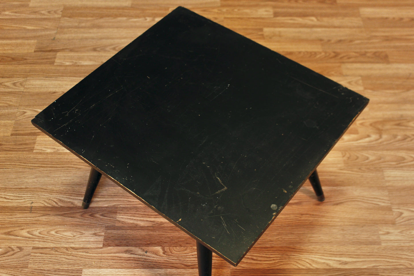Compact Atomic Black Swivel-Top Coffee Table