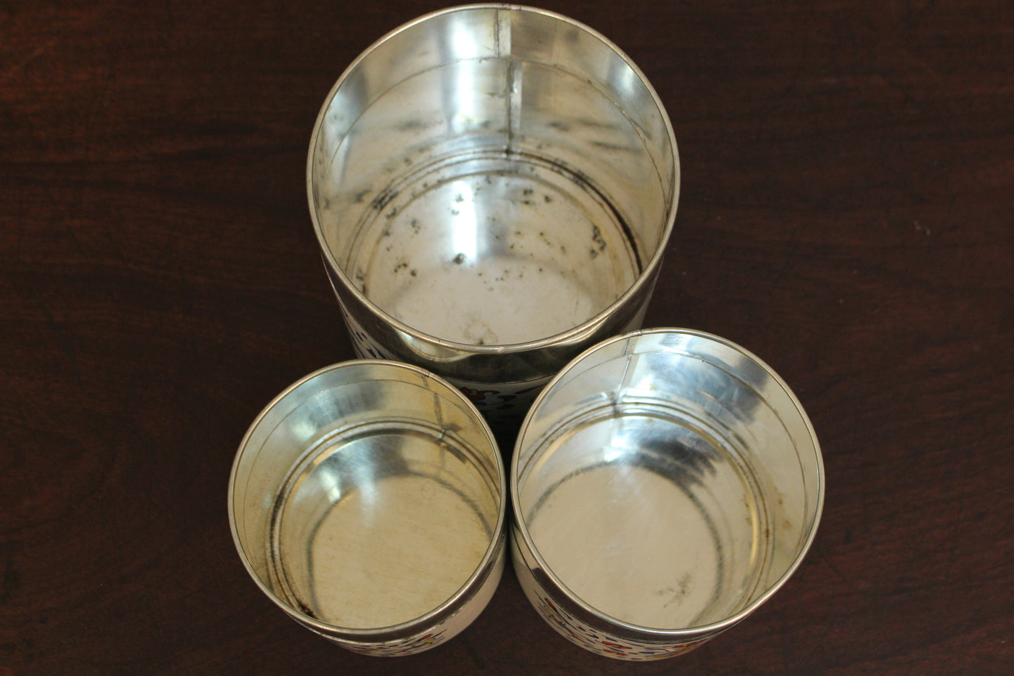 Trio of Yellow Floral Tin Canisters